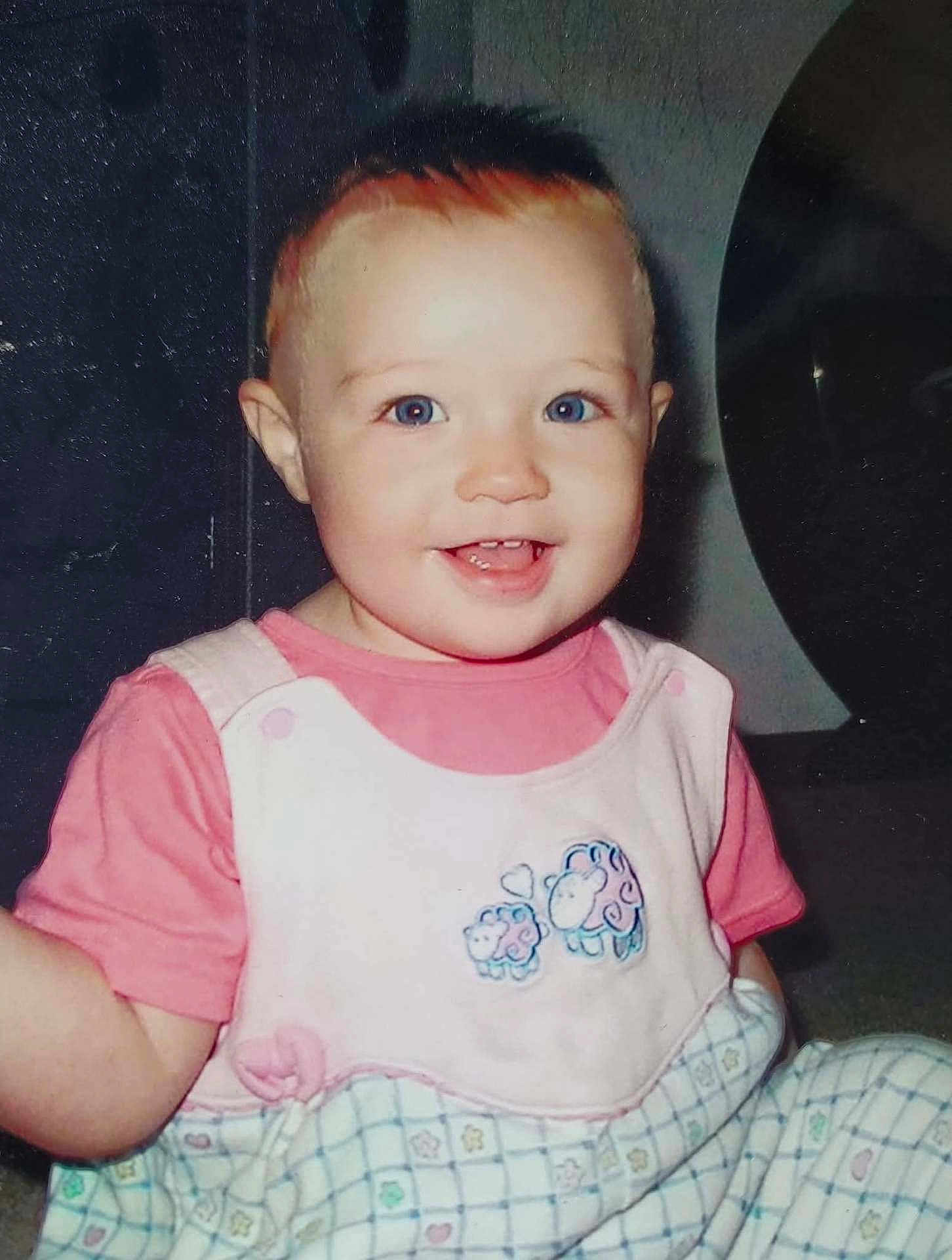 Summer joined the competition — help win amazing prizes! toddler, child, smiling, blue_eyes, pink_shirt, overall, sheep_embroidery, indoor, baby, cute, happy, person, clothing, face, head, sitting, young_child, portrait, infant, cheerful