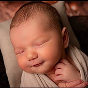 Matéo participe au concours pour gagner de l'argent avec cette photo : newborn, baby, sleeping, smiling, wrapped, blanket, closeup, face, infant, soft, cozy, portrait, peaceful, resting, hands, skin, cute, warm, head, young