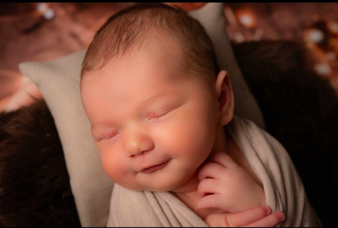 Matéo participe au concours pour gagner de l'argent avec cette photo : newborn, baby, sleeping, smiling, wrapped, blanket, closeup, face, infant, soft, cozy, portrait, peaceful, resting, hands, skin, cute, warm, head, young