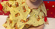 Alyocea joined the competition — help win amazing prizes! baby, bed, child, cute, face, happy, hospital_gown, indoor, infant, person, playful, polka_dot, red_ankleband, red_wristband, sitting, smiling, tiger_print, white_sheet, yellow_clothing, young_child