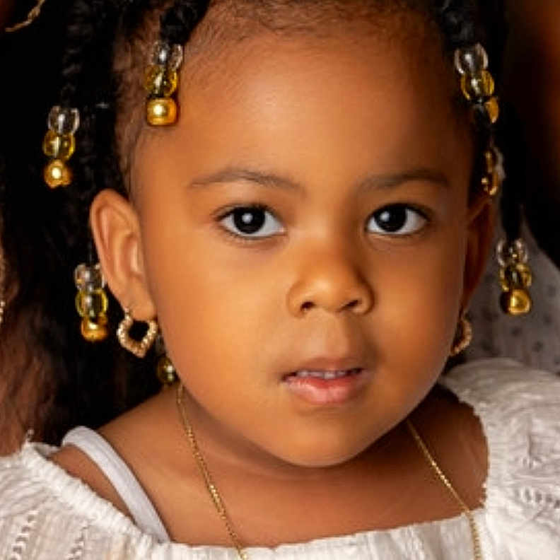 Imani is registered to the contest to win money with this photo: accessories, blackhair, bodypart, child, earring, face, female, girl, hair, happy, head, jewelry, neck, necklace, person, photography, portrait, shoulder, skin, smile