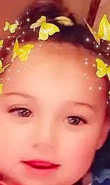 Jessi is registered to the contest to win money with this photo: beauty, brown_hair, cheek, child, eyebrow, eyelash, face, fashion_accessory, floral_design, hair_accessory, happy, headgear, headpiece, iris, lip, people_in_nature, person, petal, plant, portrait_photography