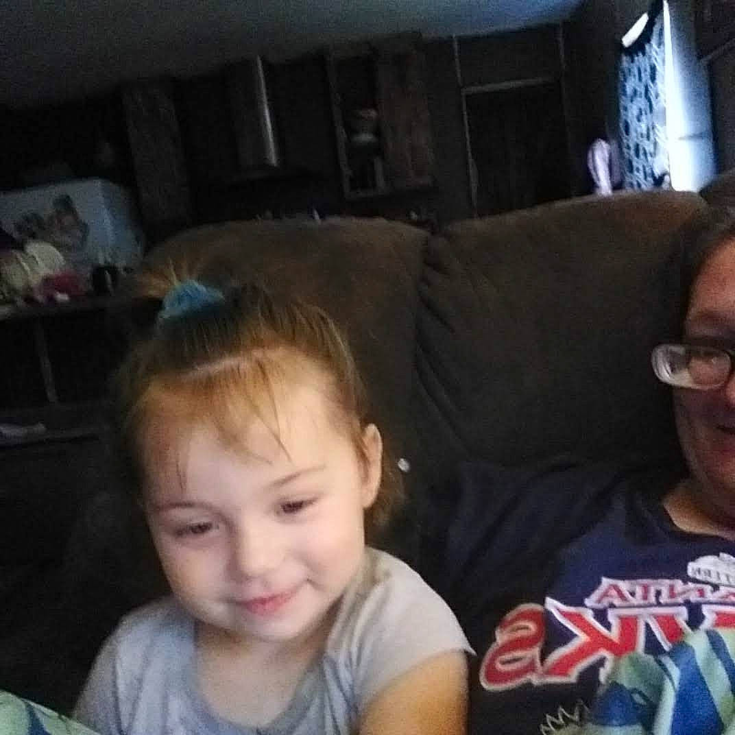 Jessi is registered to the contest to win money with this photo: baby, cheek, child, cloud, comfort, cool, couch, ear, electronic_device, forehead, fun, glasses, happy, head, iris, joy, mouth, nose, person, sitting