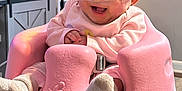 Aubree joined the competition — help win amazing prizes! baby, infant, smiling, nasal_cannula, pink_bumbo_seat, socks, indoor, table, lamp, furniture, happy, child, person, cute, healthcare, oxygen_tube, cozy, home, seated, expression
