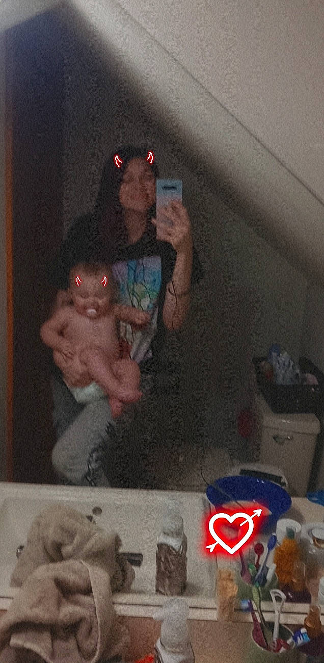 Arriah is registered to the contest to win money with this photo: arm, black, chest, elbow, event, eyewear, finger, fun, gesture, hand, human_body, mouth, muscle, organ, person, photograph, room, snapshot, thumb, trunk