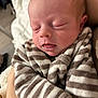 Paolo participe au concours pour gagner de l'argent avec cette photo : arm, baby, blanket, close_up, cozy, eyelids, face, hand, head, indoors, infant, lips, mouth, newborn, onesie, peaceful, portrait, skin, sleeping, striped_clothing