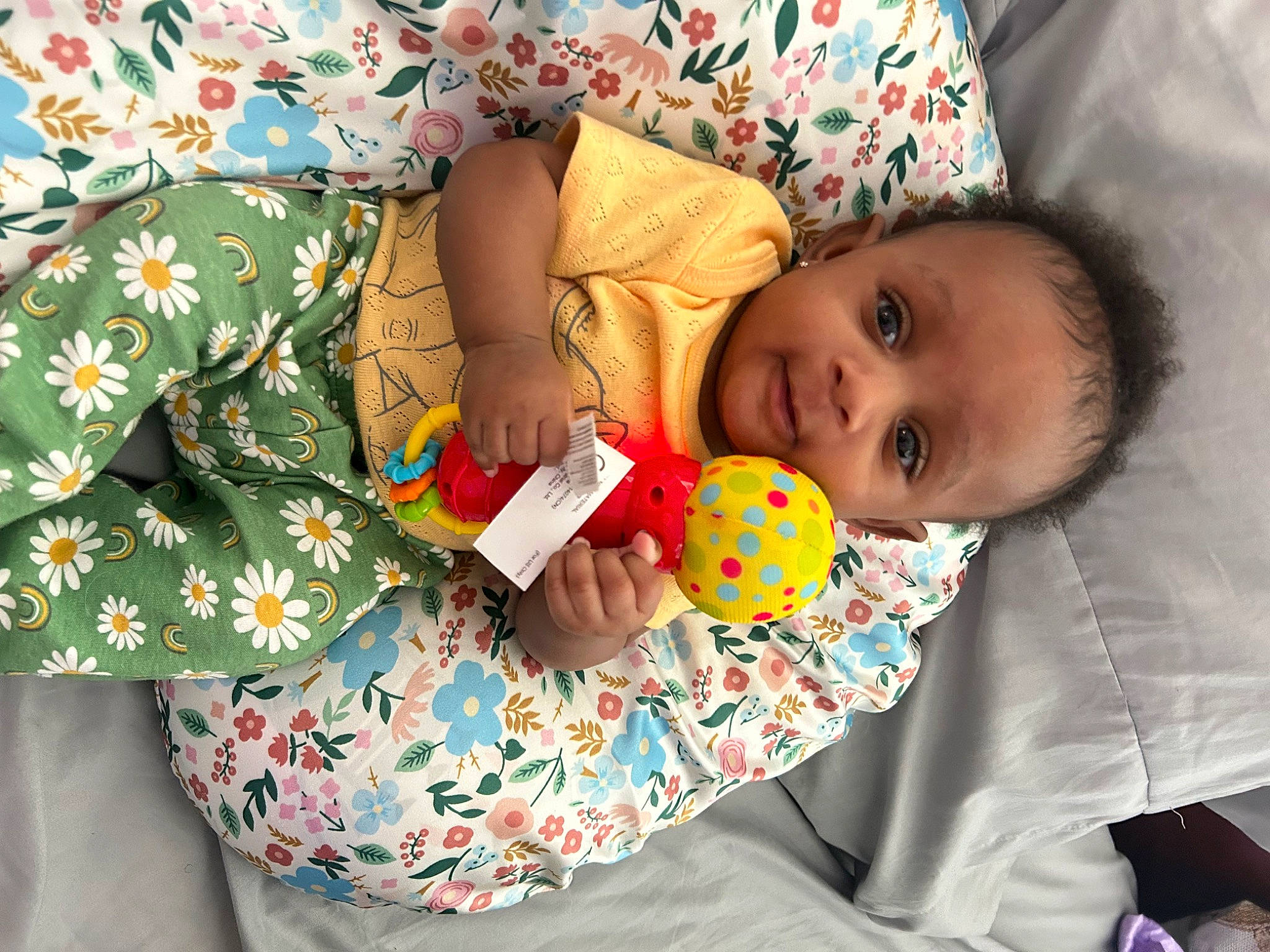 Mariah is registered to the contest to win money with this photo: baby, baby_products, baby_toddler_clothing, bedtime, cheek, child, comfort, happy, linens, nightwear, pattern, person, play, room, sitting, skin, sleeve, textile, toddler, toy