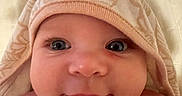 Kaelahni joined the competition — help win amazing prizes! baby, blanket, cheeks, child, closeup, cute, expression, eyes, face, happy, headwear, hooded_towel, indoor, infant, newborn, portrait, skin, smile, soft_texture, towel