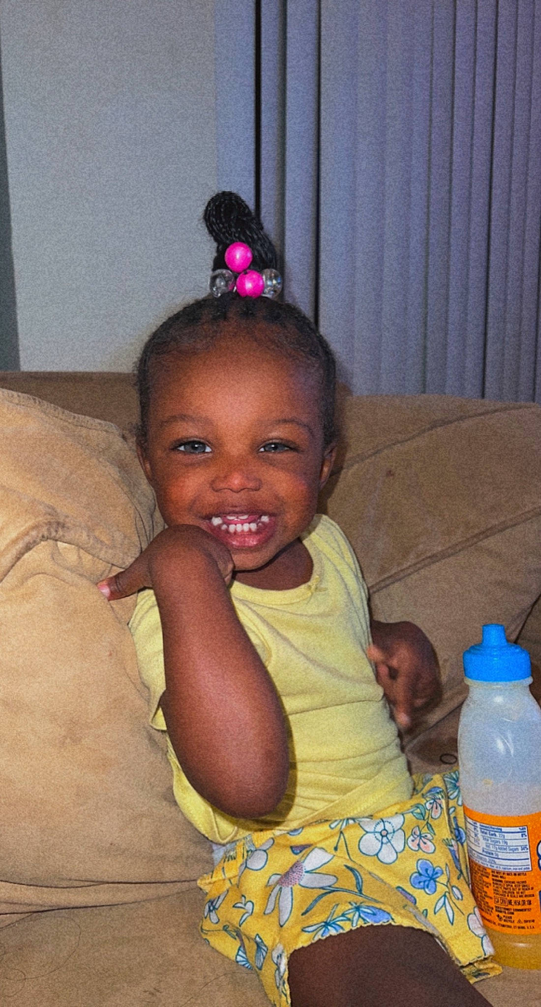 Aveay is registered to the contest to win money with this photo: baby, bottle, child, curtain, drink, drinking_water, drinkware, event, fun, hairstyle, happy, head, joy, person, plastic_bottle, sitting, skin, smile, t_shirt, toddler