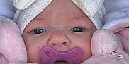 Lya participe au concours pour gagner de l'argent avec cette photo : baby, pacifier, bow, hat, blanket, pink, white, face, closeup, child, infant, cute, soft, warm, sleepy, clothing, portrait, newborn, headwear, bundle