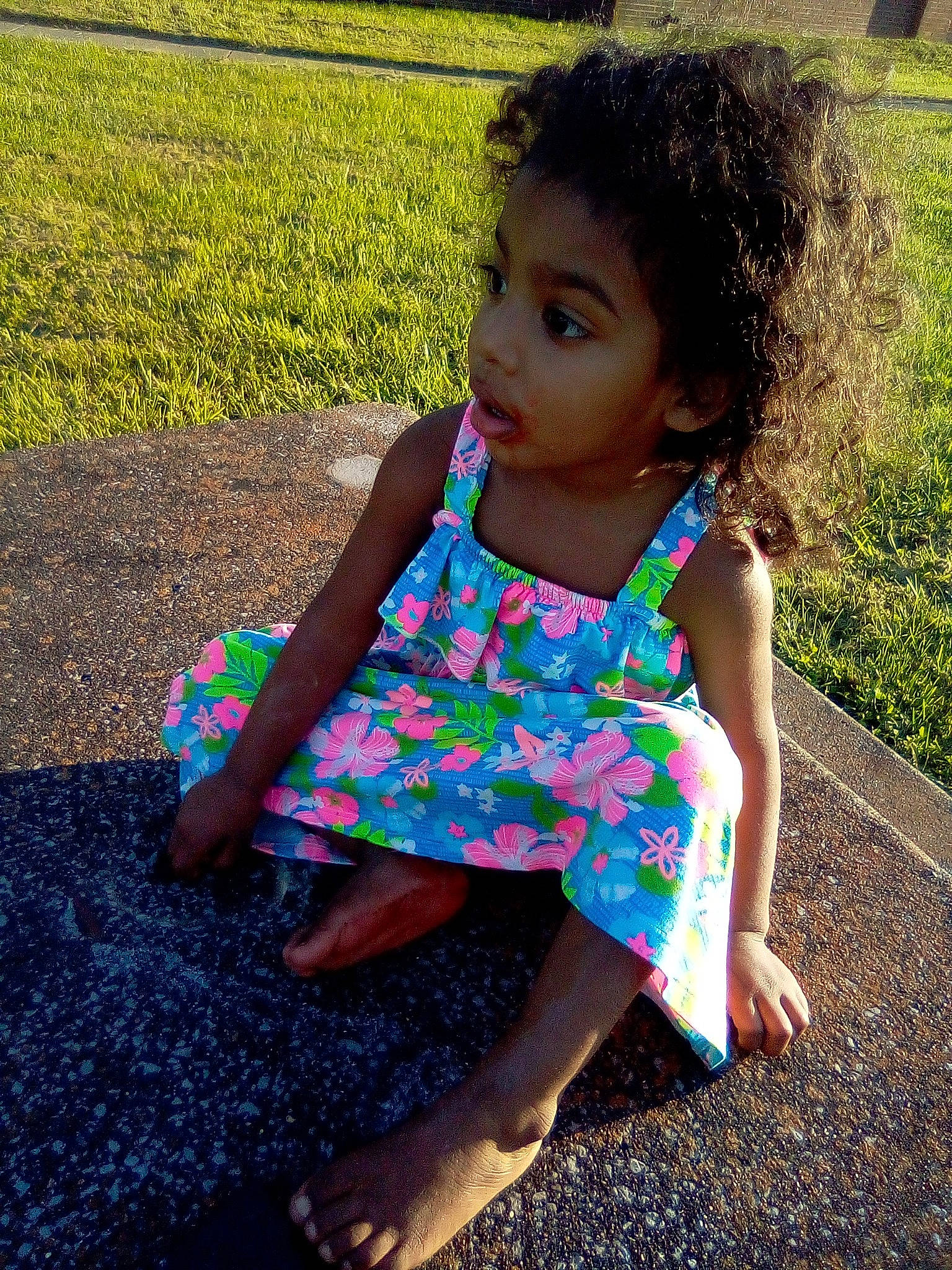 Ganiya is registered to the contest to win money with this photo: adaptation, beauty, child, dress, grass, pattern, person, plant, play, recreation, sitting, skin, smile, summer, toddler, vacation