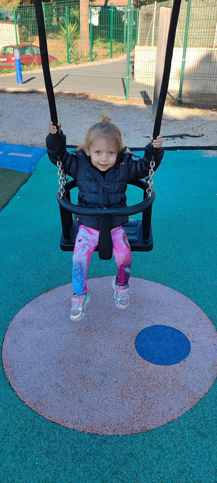 Dana participe au concours pour gagner de l'argent avec cette photo : asphalt, balance, blue, circle, city, electric_blue, fictional_character, flooring, fun, joy, leisure, magenta, person, photograph, play, recreation, road_surface, shoe, smile, snapshot