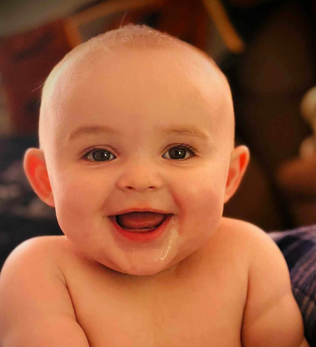 Wade joined the competition — help win amazing prizes! baby, smiling, face, drool, child, portrait, happy, cute, skin, eyes, mouth, cheeks, expression, infant, closeup, head, bare_shoulders, indoors, warm_lighting, person