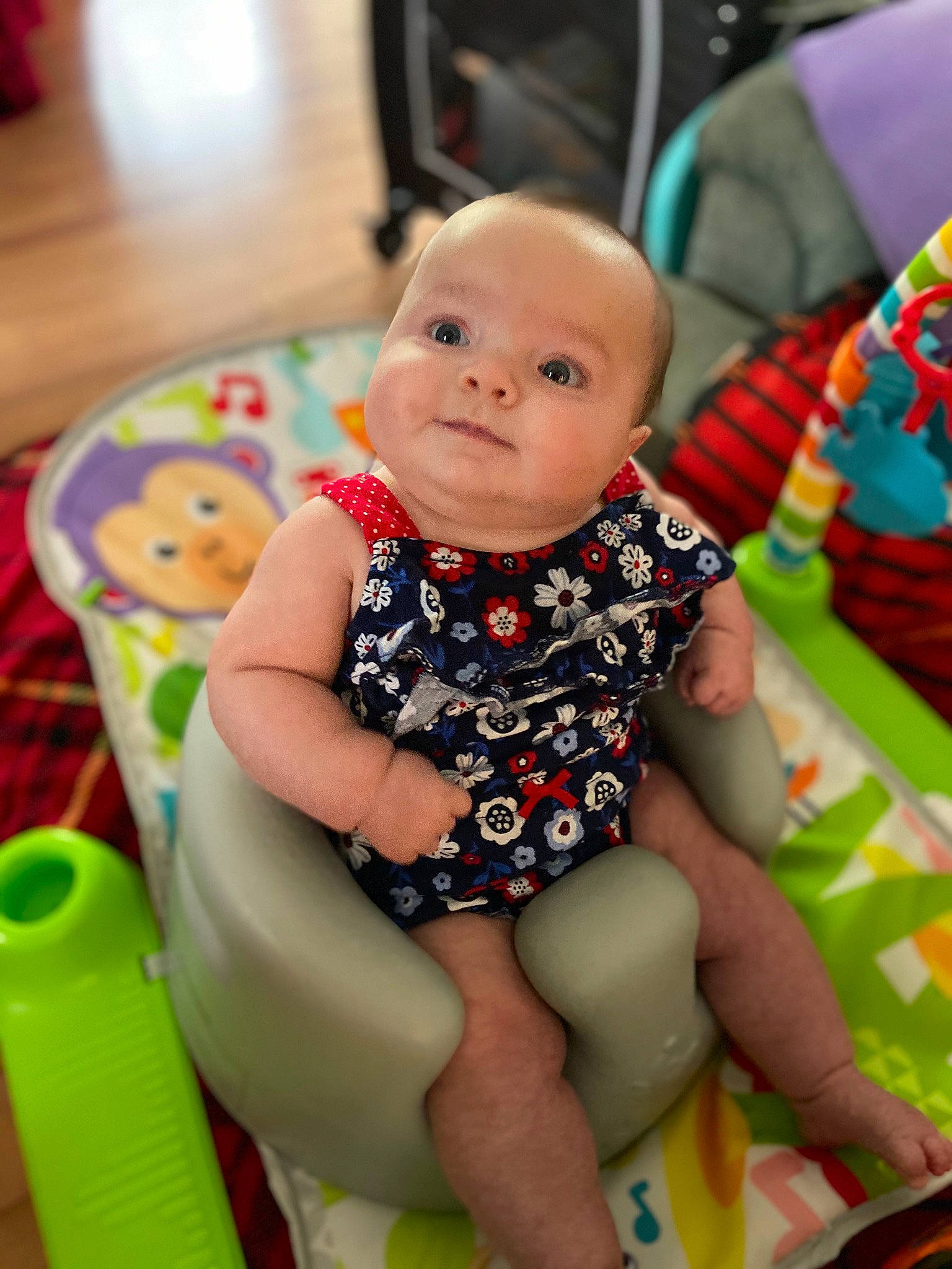 Harleigh joined the competition — help win amazing prizes! baby, baby_toddler_clothing, cheek, child, comfort, event, facial_expression, fun, green, happy, leisure, person, photograph, product, sitting, skin, snapshot, sock, thigh, toddler
