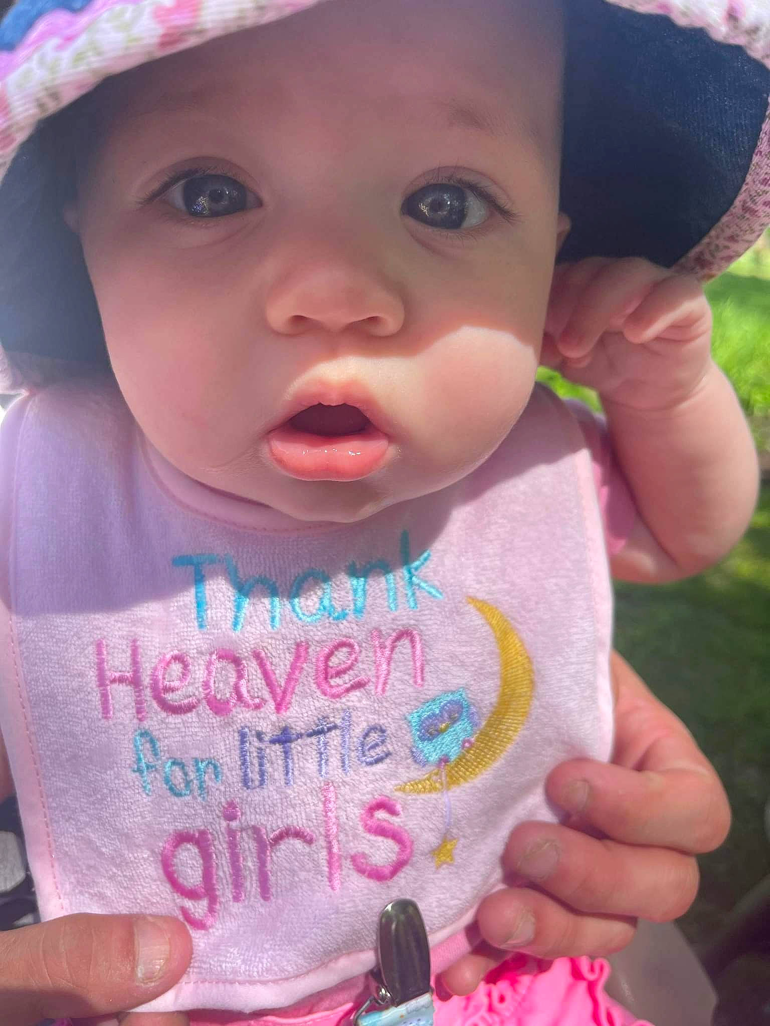 Lauren is registered to the contest to win money with this photo: baby, baby_toddler_clothing, cap, cheek, chin, dress, eyelash, facial_expression, finger, gesture, happy, hat, headwear, lip, mouth, nose, person, pink, skin, sleeve