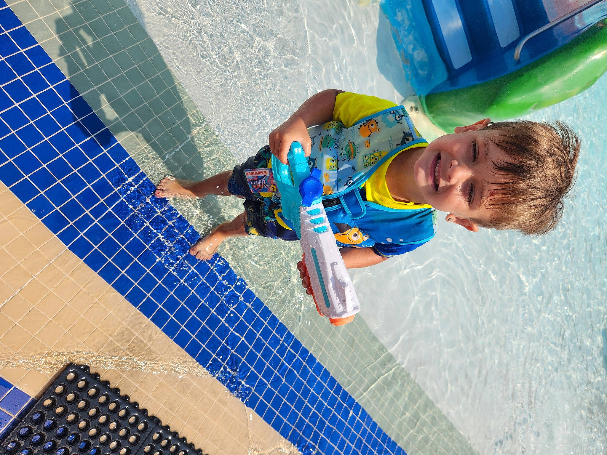 Memphis is registered to the contest to win money with this photo: child, composite_material, electric_blue, flooring, fun, joy, leisure, mesh, net, pattern, person, play, recreation, smile, sports, toddler, water