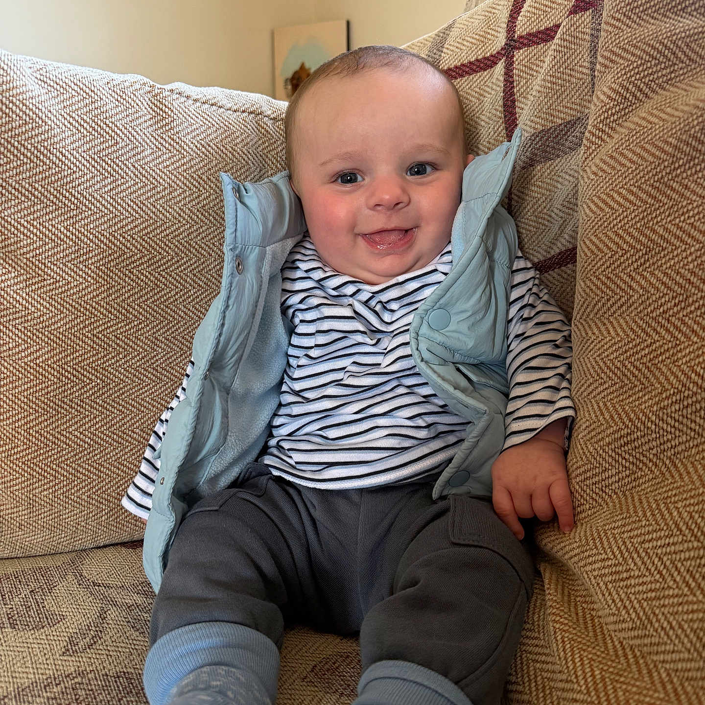 Franky is registered to the contest to win money with this photo: baby, bodypart, chair, clothing, couch, cushion, face, finger, furniture, hand, happy, head, homedecor, jeans, pants, person, photography, portrait, sitting, smile