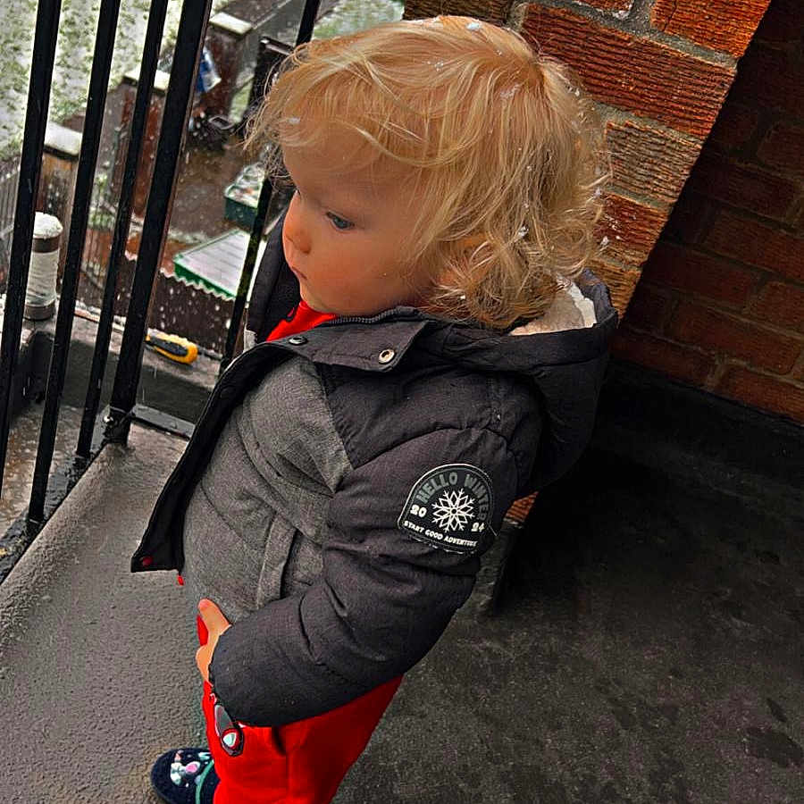 Theo is registered to the contest to win money with this photo: blonde, boy, child, city, clothing, coat, face, footwear, hair, head, jacket, male, pants, person, photography, portrait, road, shoe, street, urban