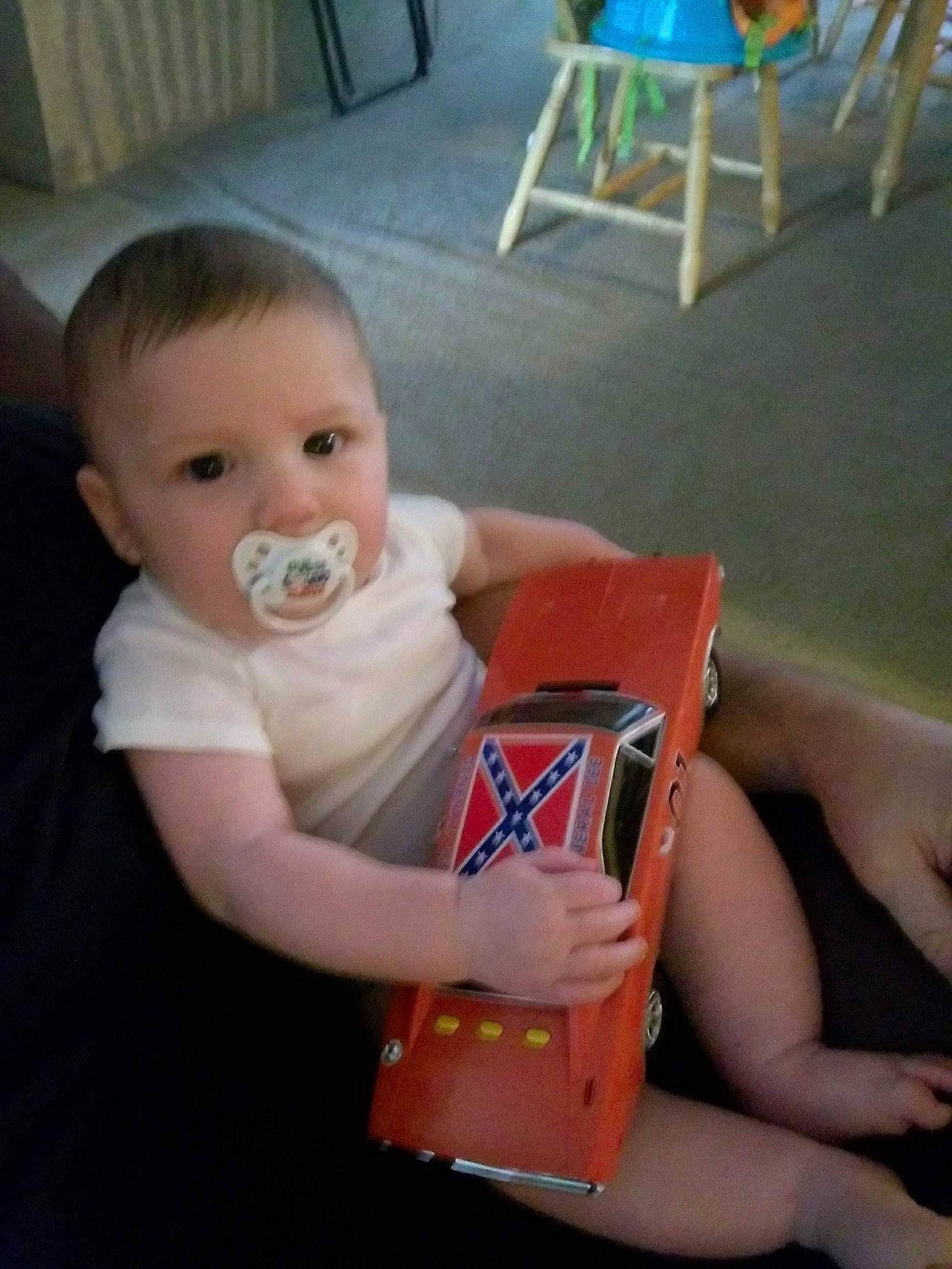 Dillon is registered to the contest to win money with this photo: arm, child, day, finger, fun, hand, infant, mouth, person, play, product, sitting, toddler