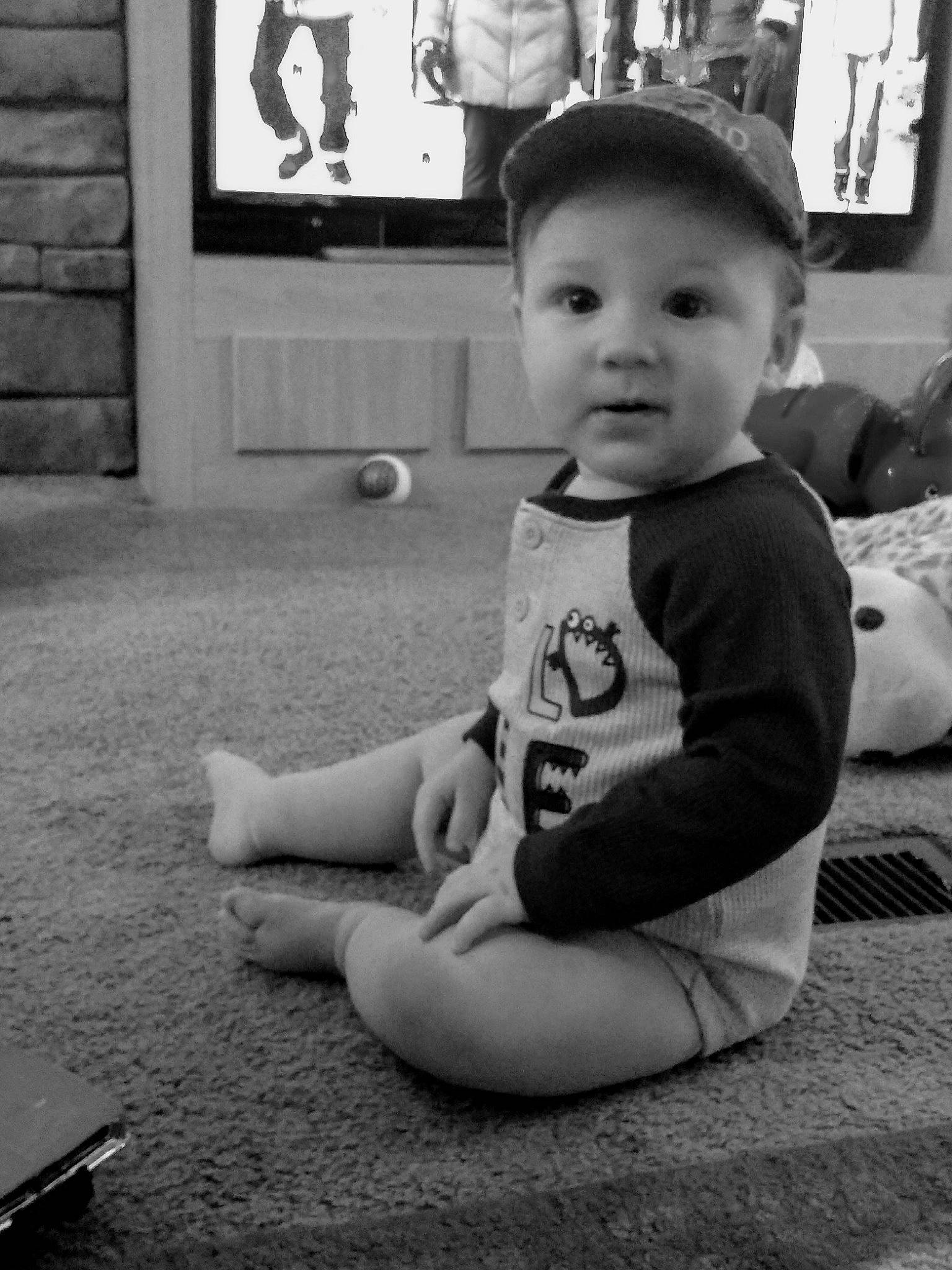 Dillon is registered to the contest to win money with this photo: black, black_and_white, boy, child, day, emotion, eye, facial_expression, infant, monochrome, monochrome_photography, person, photograph, photography, sitting, smile, snapshot, standing, toddler, white