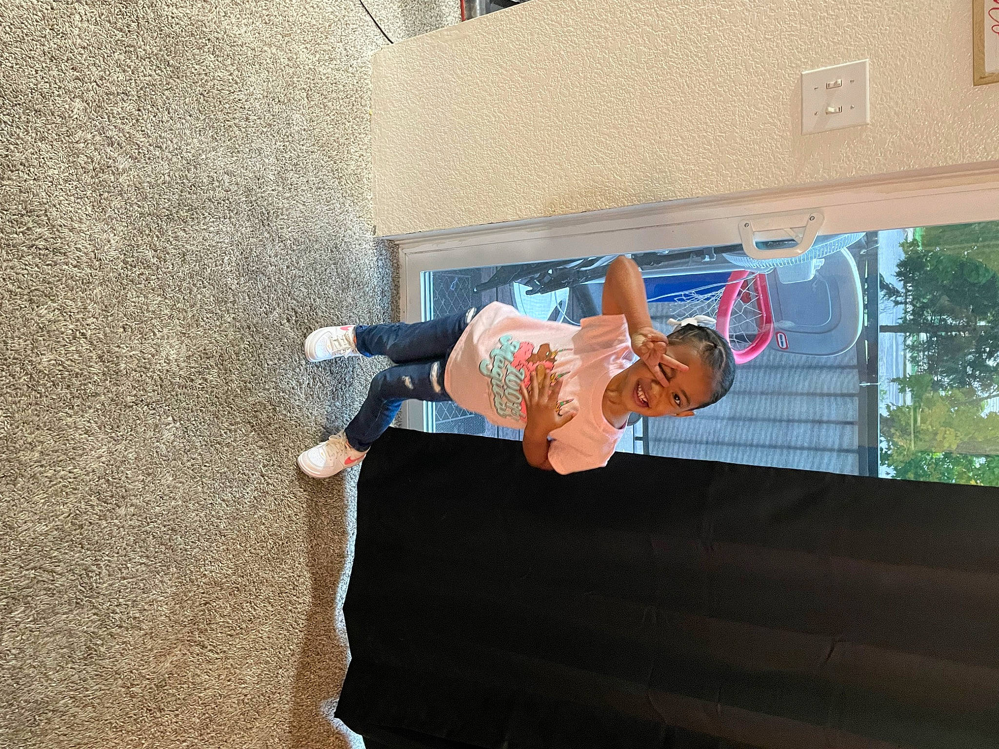 Kaliyah joined the competition — help win amazing prizes! asphalt, child, concrete, denim, flooring, fun, human_leg, joy, leisure, person, plant, recreation, shadow, t_shirt, toddler, tree, vacation, walking_shoe, window, wood