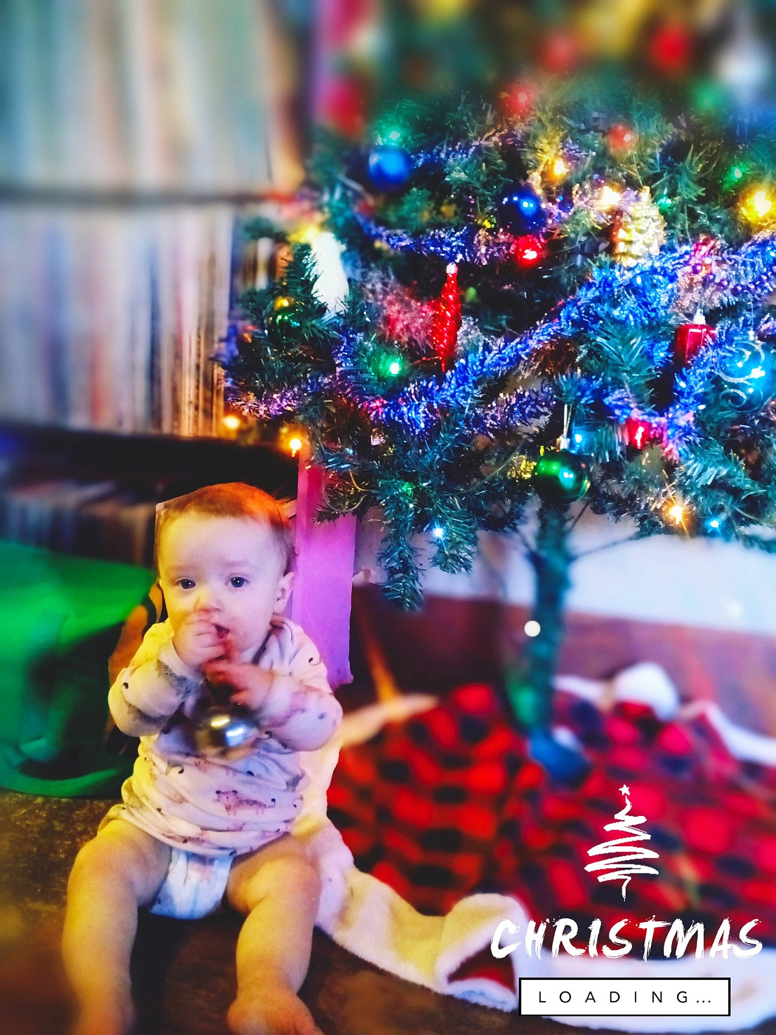 Sayla is registered to the contest to win money with this photo: baby, baby_toddler_clothing, christmas, christmas_decoration, christmas_eve, christmas_ornament, christmas_tree, conifer, decoration, event, fun, happy, holiday, holiday_ornament, interior_design, lighting, ornament, person, purple, toddler