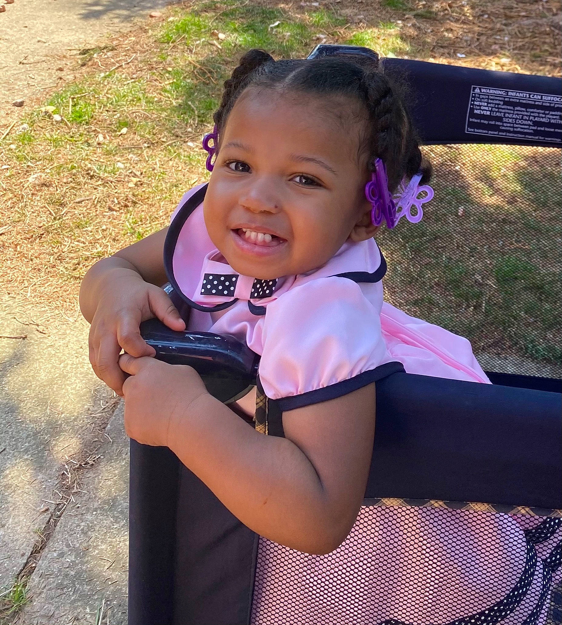 Nevaeh is registered to the contest to win money with this photo: audio_equipment, child, electric_blue, fashion_accessory, fun, gesture, grass, happy, joy, leisure, magenta, person, personal_protective_equipment, purple, recreation, smile, sports_uniform, sportswear, toddler