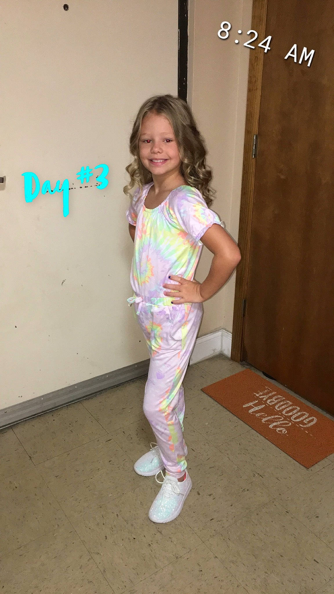 Tana is registered to the contest to win money with this photo: active_pants, baby_toddler_clothing, flooring, happy, human_leg, joy, knee, magenta, pajamas, pattern, person, room, sleeve, smile, sock, sportswear, standing, sweatpant, t_shirt, thigh