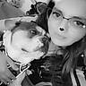 person, dog, glasses, black_and_white, face_filter, sparkles, indoor, pet, cuddle, casual_clothing, closeup, smile, animal_ears, heart_shape, cute, companion, friendship, portrait, relaxation
