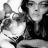 woman, dog, selfie, black_and_white, glasses, digital_filter, bear_ears, hearts, face, pet, indoors, blanket, close_up, companion, cute, whimsical, portrait, casual, relaxed, friendship