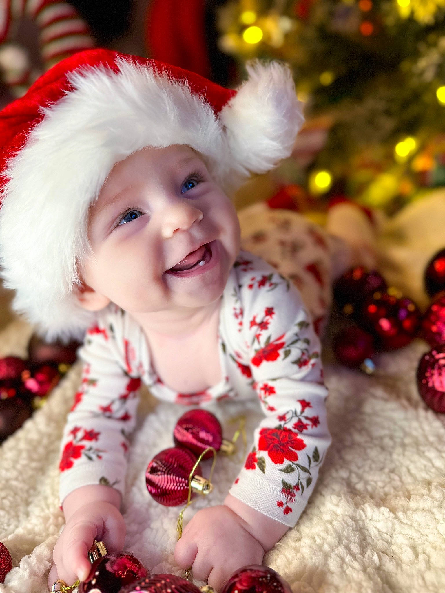 Kambria joined the competition — help win amazing prizes! baby, baby_toddler_clothing, child, christmas_eve, christmas_ornament, christmas_tree, dress, event, eye, facial_expression, fun, happy, head, headwear, human_body, joy, person, red, skin, sleeve