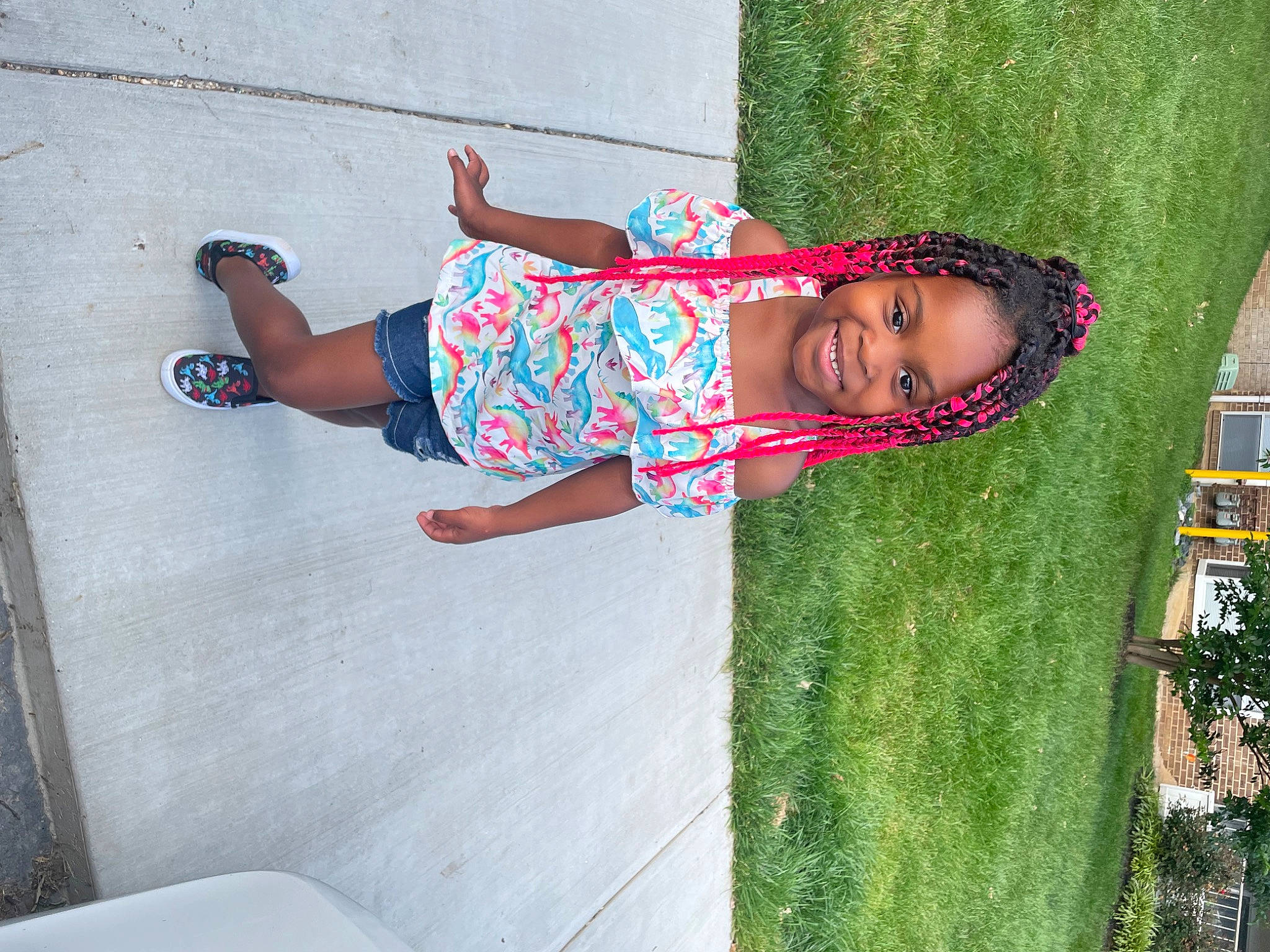 Mckynzie is registered to the contest to win money with this photo: concrete, cool, fun, grass, happy, human_leg, joy, leisure, magenta, person, plant, recreation, sidewalk, smile, t_shirt, textile, thigh, toddler, tree, vacation