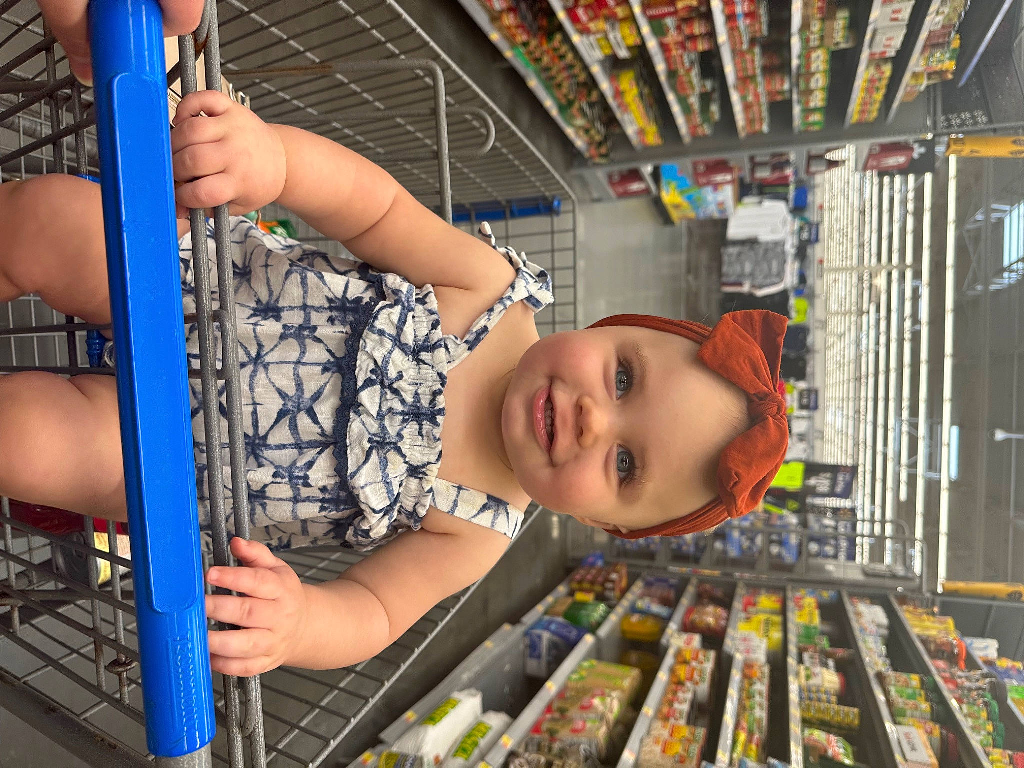 Mckenna is registered to the contest to win money with this photo: blue, bookcase, child, city, customer, fun, happy, headwear, human_leg, joy, leisure, person, play, product, publication, recreation, retail, shelf, smile, snapshot