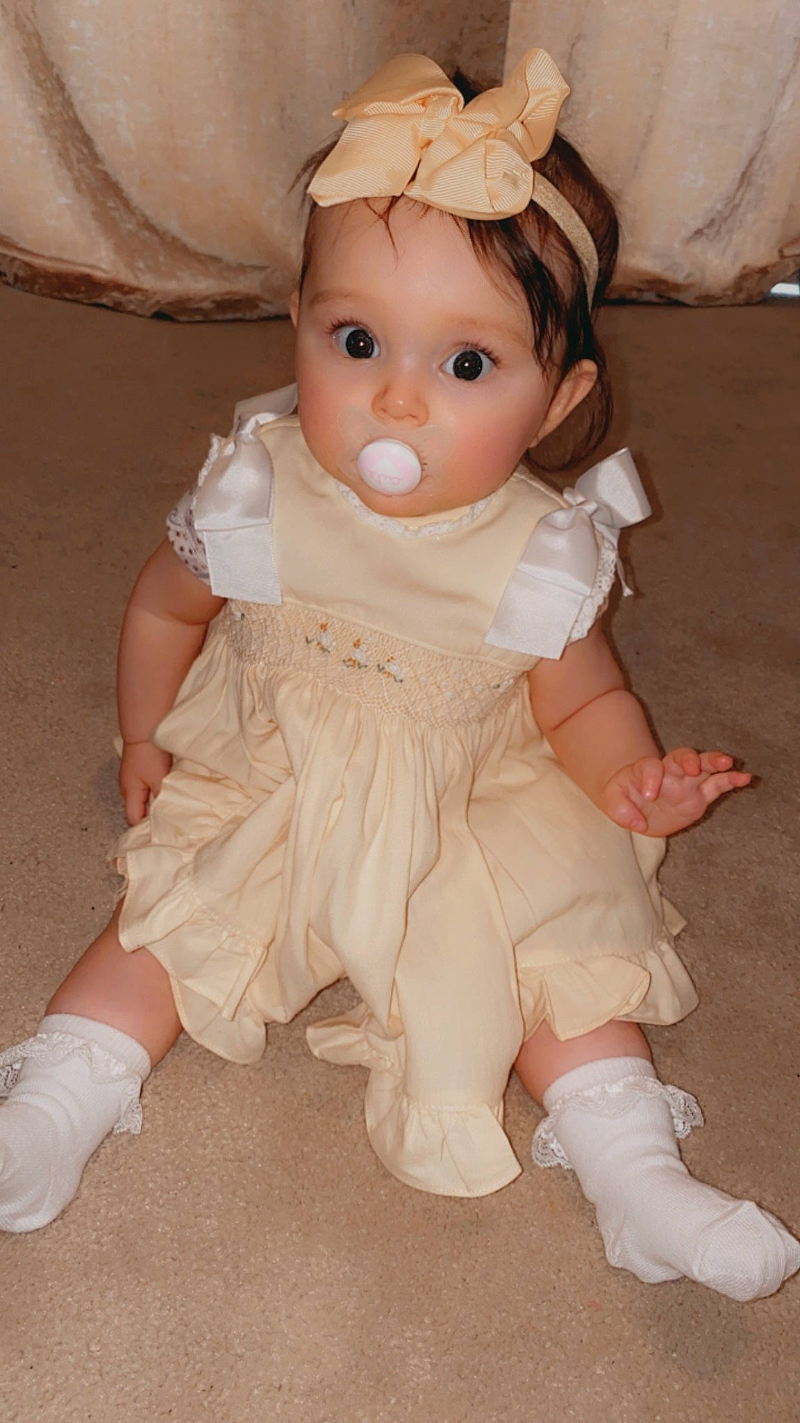 Evelyn joined the competition — help win amazing prizes! baby_toddler_clothing, bridal_accessory, cheek, doll, dress, eye, eyelash, face, headgear, headpiece, human_body, iris, lip, person, petal, pink, skin, sleeve, surprise, toy