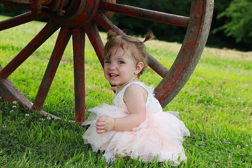 Bryleigh joined the competition — help win amazing prizes! baby, child, dress, grass, happy, joy, person, photograph, photography, plant, sitting, skin, smile, toddler