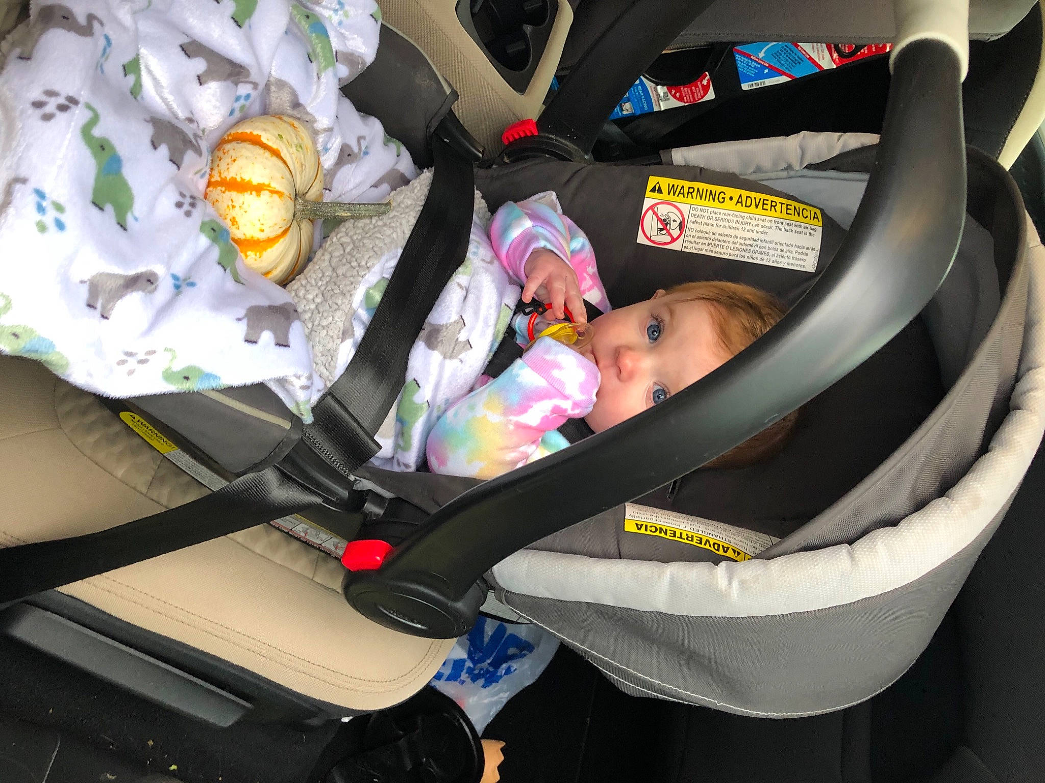 Kelce is registered to the contest to win money with this photo: auto_part, baby_carriage, baby_in_car_seat, baby_products, car, car_seat, child, person, product, seat_belt, trunk, vehicle