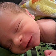 Joseph is registered to the contest to win money with this photo: newborn, baby, sleeping, smile, face, blanket, infant, closeup, skin, peaceful, rest, cute, human, child, portrait, young, soft, relaxation, cozy, comfort