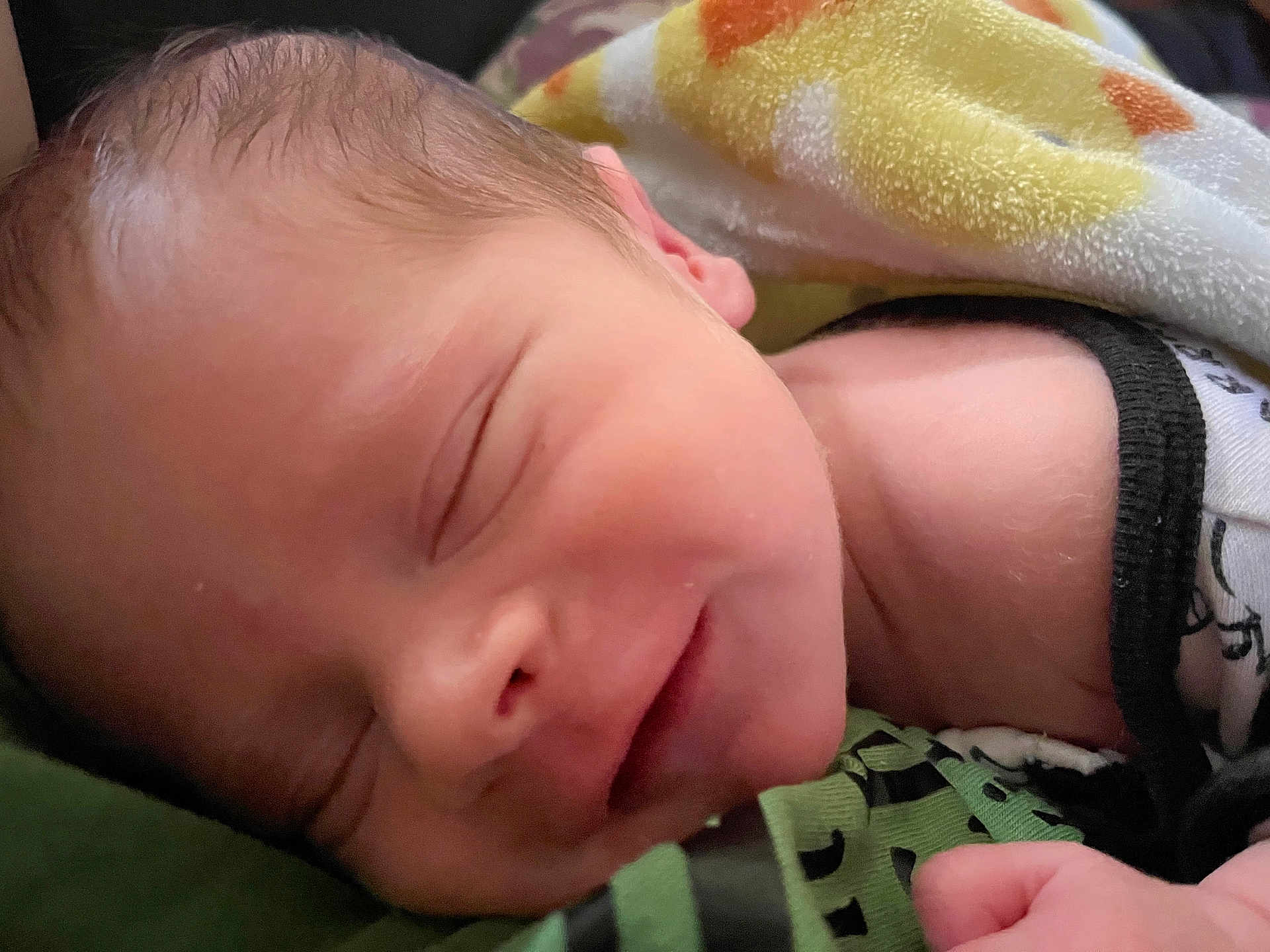 Joseph is registered to the contest to win money with this photo: newborn, baby, sleeping, smile, face, blanket, infant, closeup, skin, peaceful, rest, cute, human, child, portrait, young, soft, relaxation, cozy, comfort