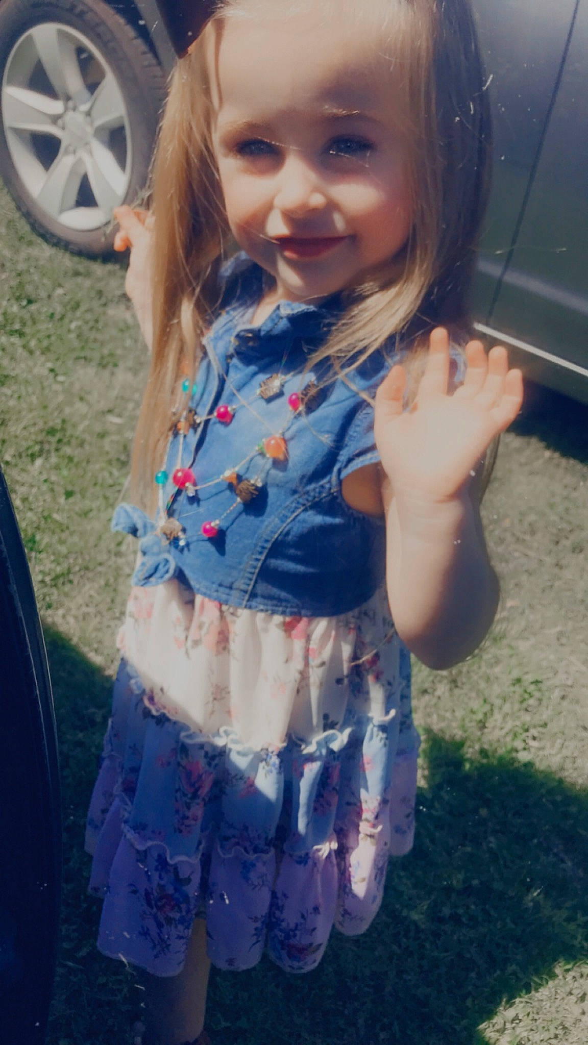 Carly joined the competition — help win amazing prizes! automotive_lighting, automotive_tire, child, cool, dress, electric_blue, grass, hair, hairstyle, happy, joy, motor_vehicle, person, pink, plant, skin, smile, summer, sunlight, tire