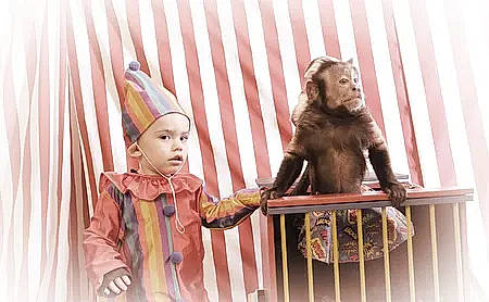 Emiliano is registered to the contest to win money with this photo: art, baby, child, event, fictional_character, figurine, fun, fur, head, headwear, lawn_ornament, mammal, person, pink, primate, room, sculpture, sitting, statue, toy