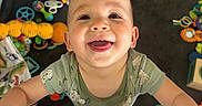 Elijah joined the competition — help win amazing prizes! baby, baby_toys, cheerful, child, clothing, colorful, cute, expression, face, hand, happy, indoor, infant, looking_up, playmat, playpen, portrait, smiling, toys, young_child