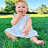 baby, child, grass, outdoor, greenery, sunlight, blue_sky, headband, dress, smiling, sitting, nature, summer, cute, happy, infant, person, portrait, trees, daylight