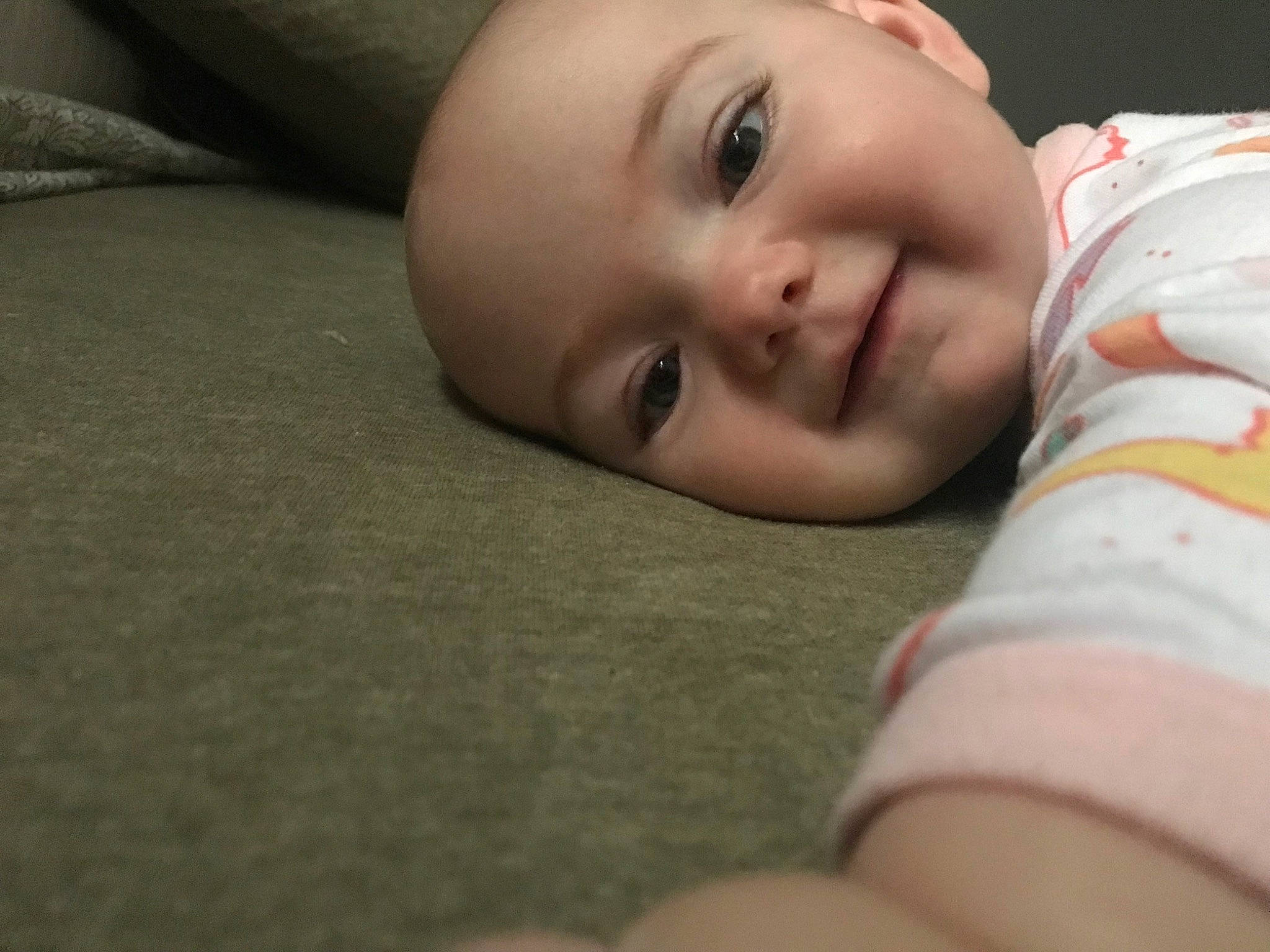 Ophelia is registered to the contest to win money with this photo: baby, baby_toddler_clothing, cheek, chin, comfort, eye, eyebrow, eyelash, flash_photography, happy, head, iris, lip, mouth, nose, person, plant, skin, sleeve, smile