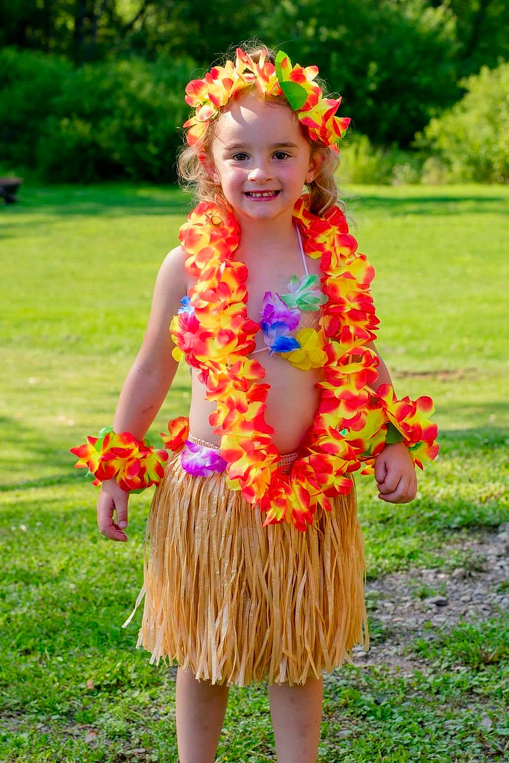 Ainsley joined the competition — help win amazing prizes! botany, child, entertainment, event, face, flower, grass, hair, hairstyle, happy, hula, jewellery, joy, lei, magenta, people_in_nature, person, pink, plant, smile