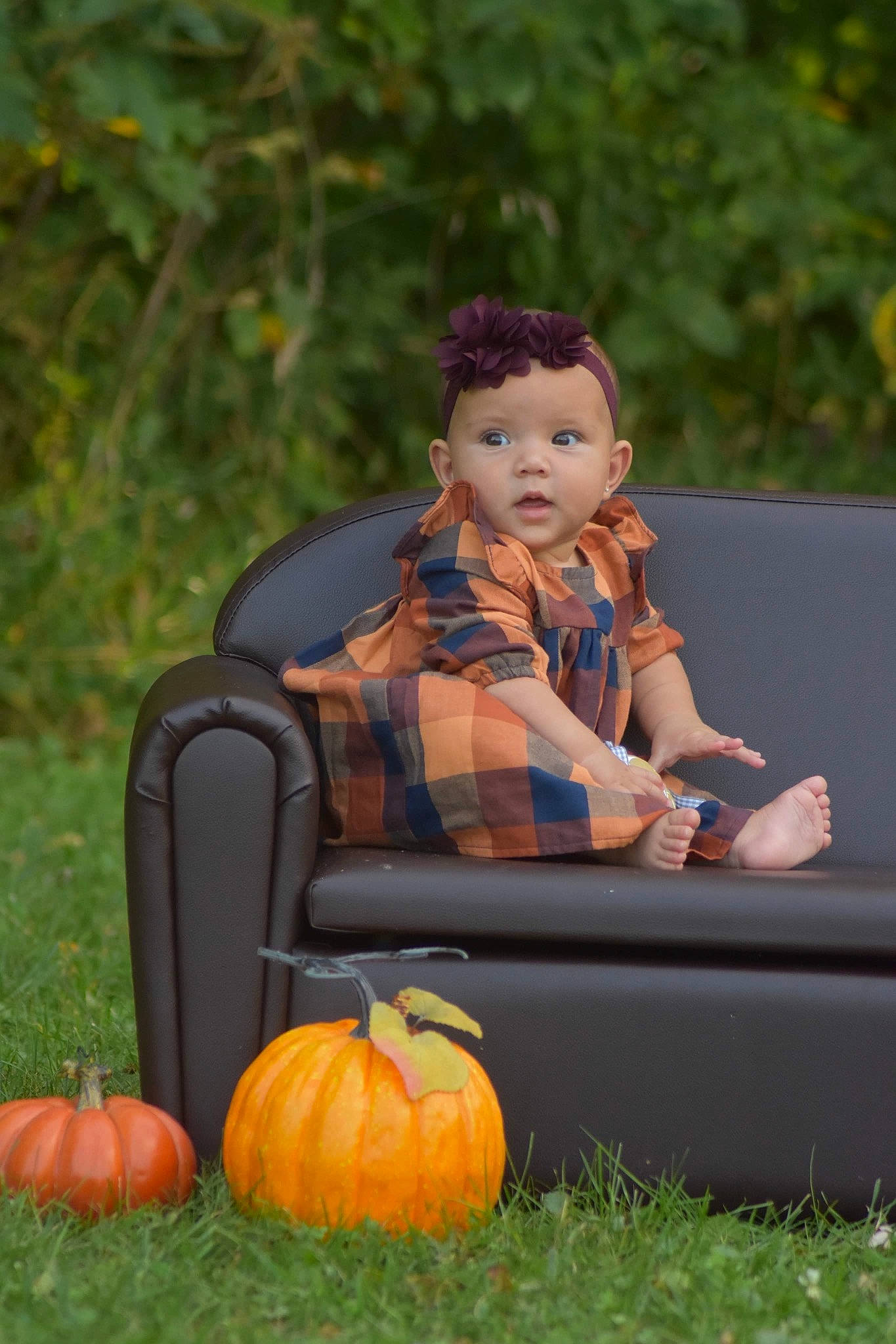 Camila is registered to the contest to win money with this photo: baby, baby_toddler_clothing, botany, calabaza, cucurbita, gourd, grass, happy, leaf, leisure, natural_foods, nature, people_in_nature, person, plant, pumpkin, squash, toddler, tree, vegetable