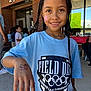 Hayliana joined the competition — help win amazing prizes! child, girl, braids, face_paint, temporary_tattoo, tshirt, field_day, elementary_school, outdoor, smile, hand, people, group, event, brick_wall, window, daylight, casual_clothing, school, celebration
