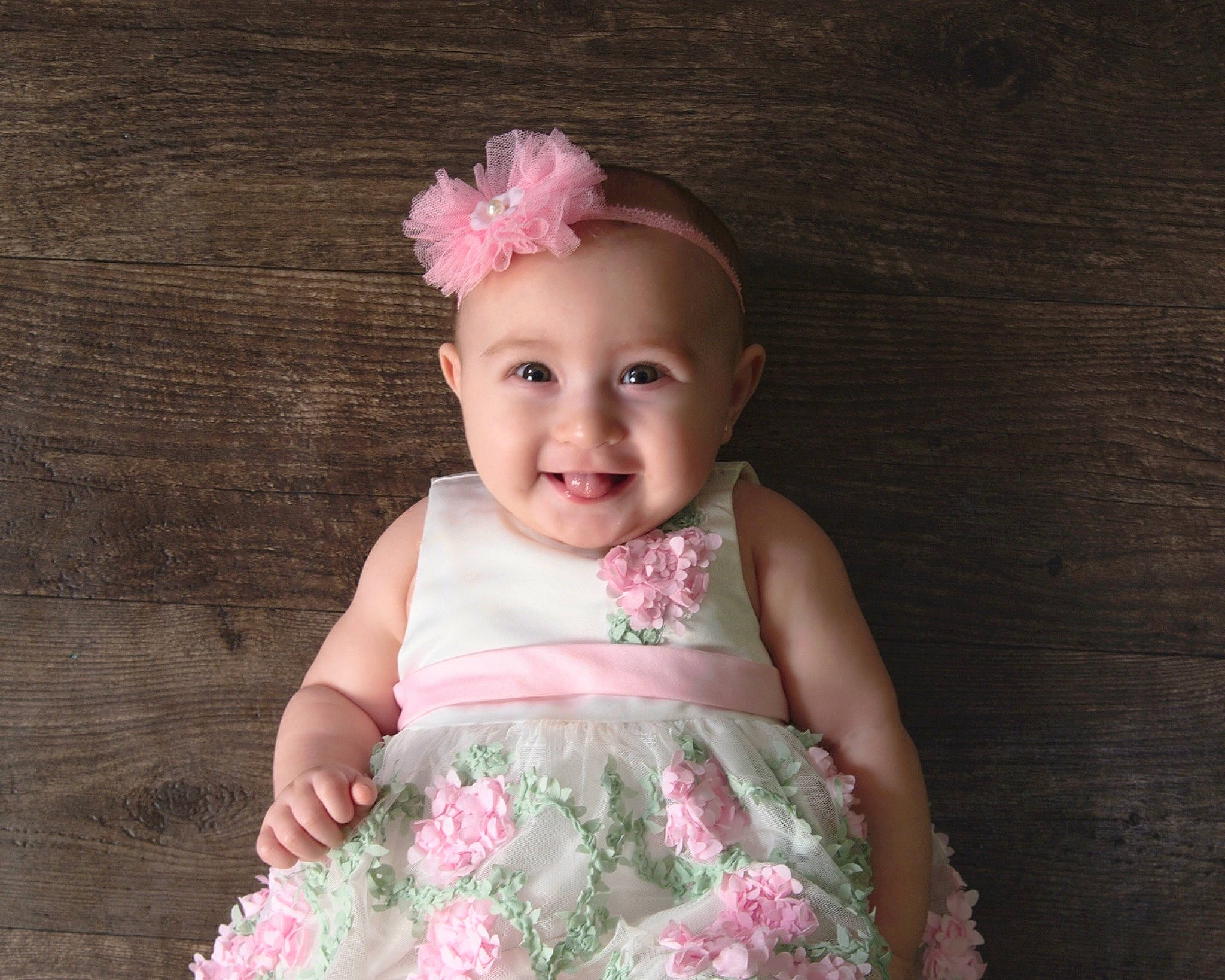 Bianca is registered to the contest to win money with this photo: baby, baby_products, baby_toddler_clothing, child, child_model, clothing, dress, fashion_accessory, hair_accessory, headgear, headpiece, joy, person, pink, product, textile, toddler