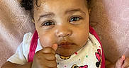 Sa'Vanii joined the competition — help win amazing prizes! baby, child, infant, pink_bow, bib, minnie_mouse, thumbs_up, close_up, cute, portrait, soft_blanket, clothing, expression, face, hand, person, indoor, adorable, young_child, fashion