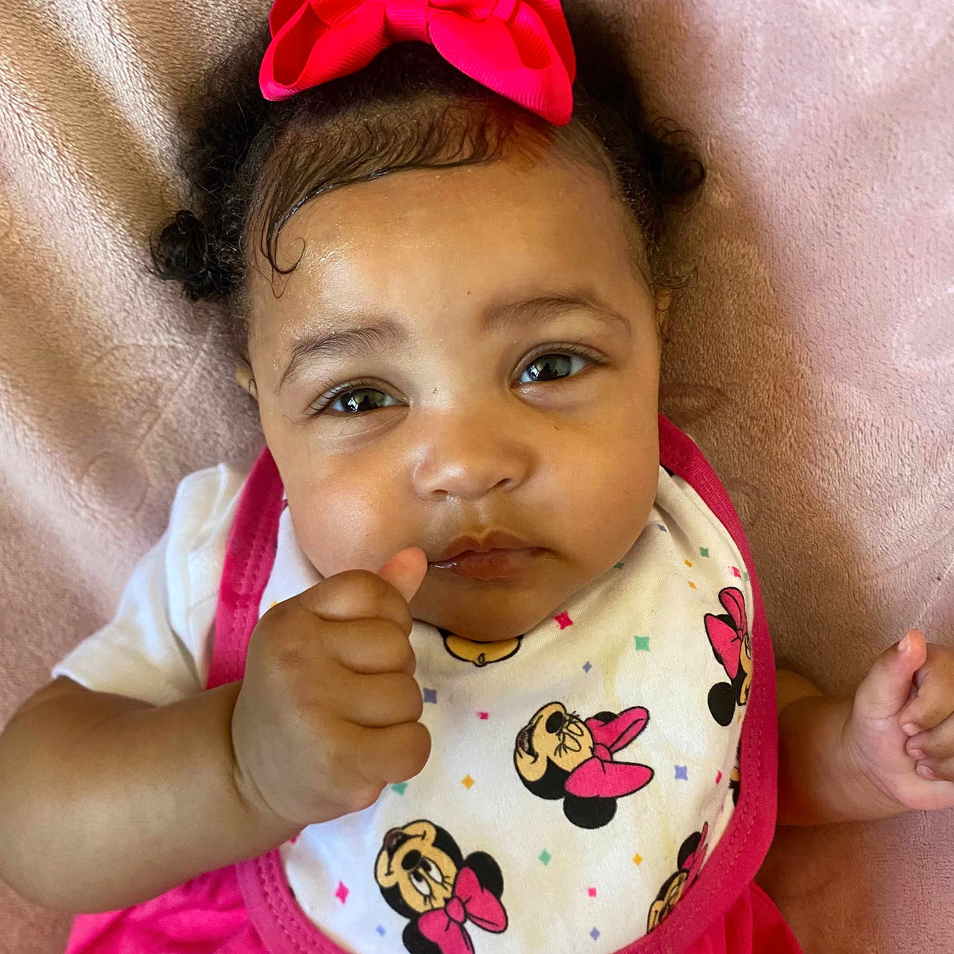 Sa'Vanii joined the competition — help win amazing prizes! baby, child, infant, pink_bow, bib, minnie_mouse, thumbs_up, close_up, cute, portrait, soft_blanket, clothing, expression, face, hand, person, indoor, adorable, young_child, fashion