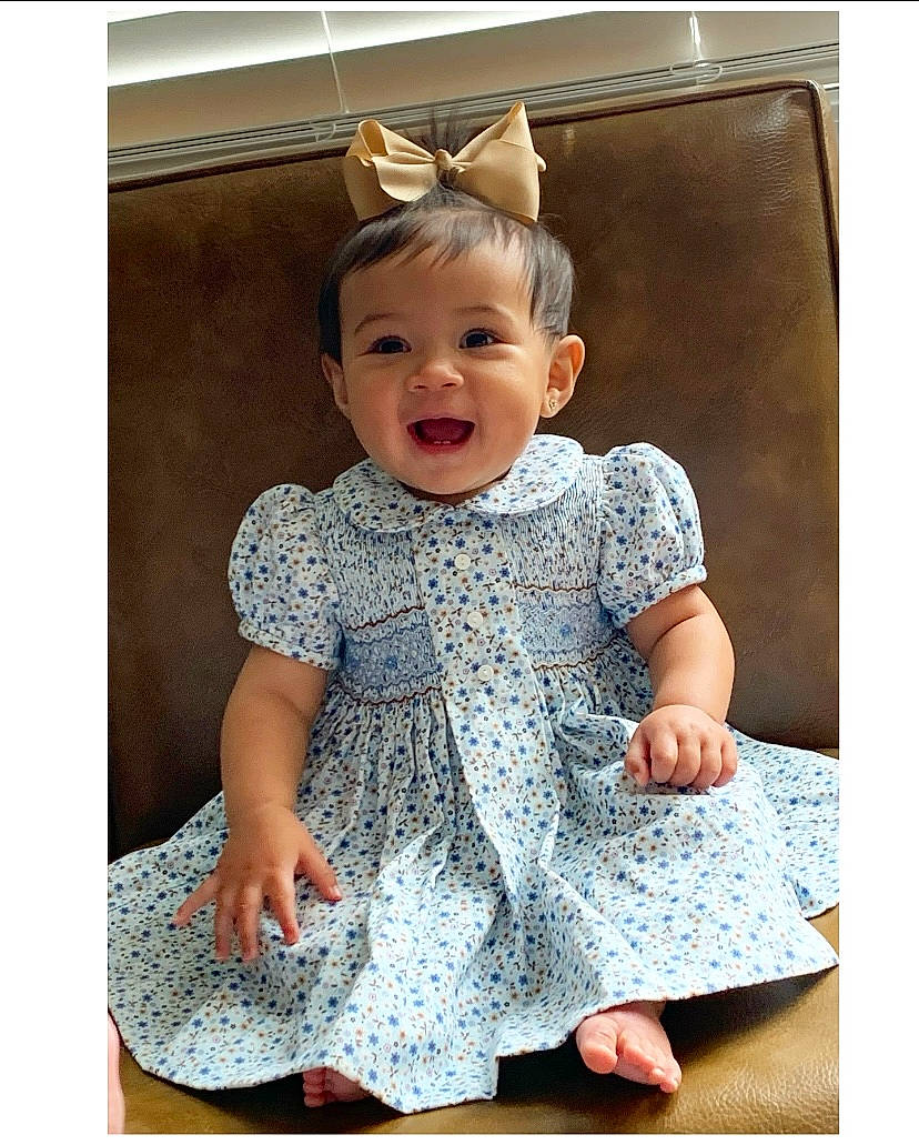 Brayleigh joined the competition — help win amazing prizes! baby, baby_toddler_clothing, child, clothing, day_dress, dress, face, happy, magenta, one_piece_garment, pattern, person, photograph, portrait_photography, rectangle, sitting, sleeve, smile, t_shirt, toddler